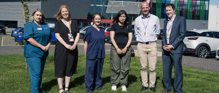 Photo of Julie Booth, NHS Forth Valley Specialist Nurse in Organ Donation, Alison Reed, NHS Forth Valley Tissue Donation Coordinator, Dr Abigail Short, NHS Forth Valley Clinical Lead for Organ Donation, Salma Hussain, Transplant recipient; Dougie Porteous, Interim Head of Sport, Physical Activity and Inclusion with Active Stirling and Matt Bunnell, Interim Chief Executive with Active Stirling