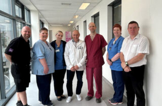 John Main, middle, and Barry Main, far left, join surgeon Alistair Geraghty, stoma care nurse Jennifer Thomson, staff from our oncology support team and representatives of the Jolly Beggars Burns Club